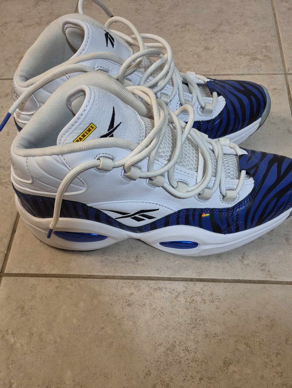 Reebok White Athletic Sneakers with Blue Zebra Accents Answer 1 Panini